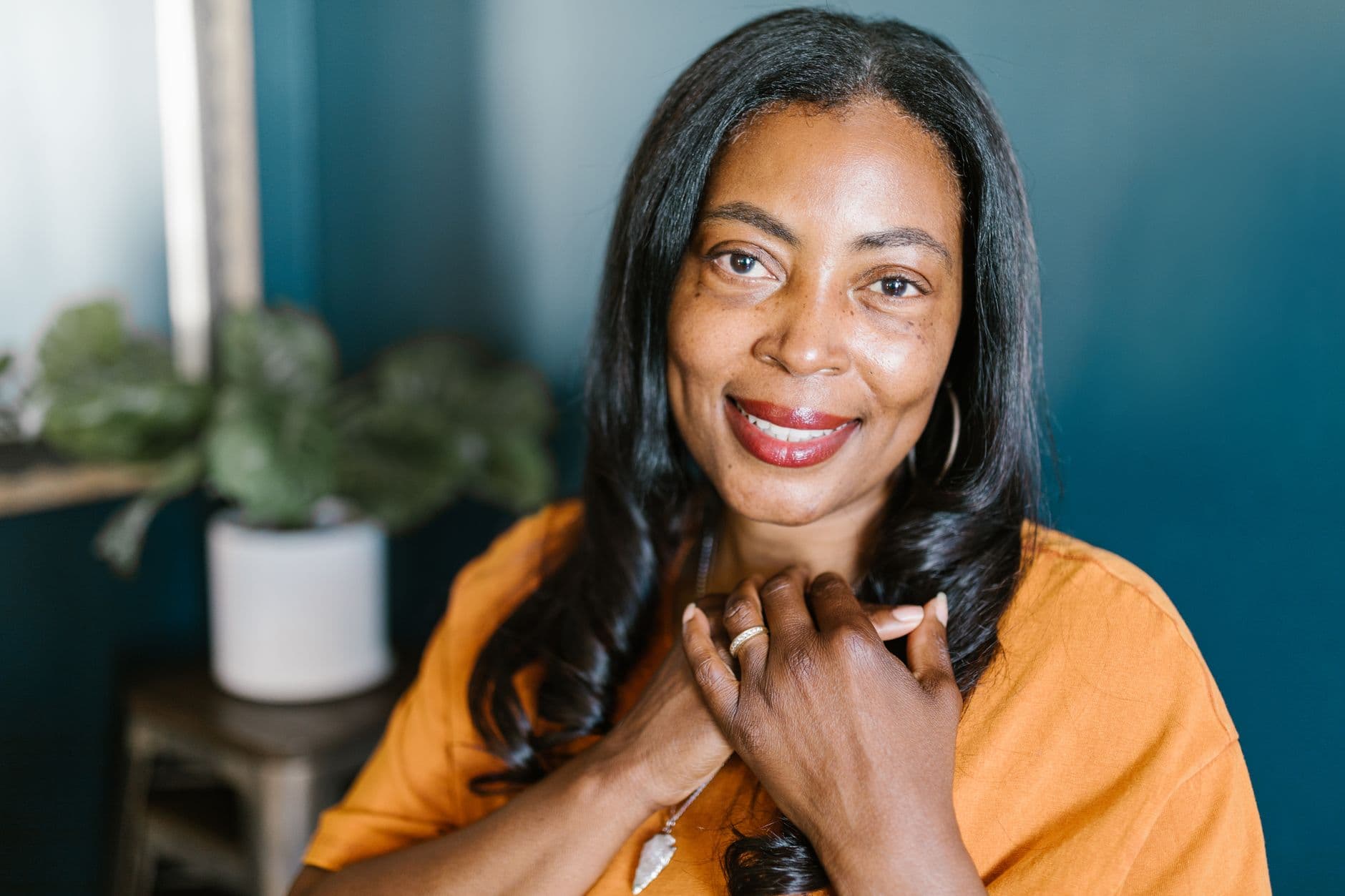 Black woman with a long, sleek weave hairstyle